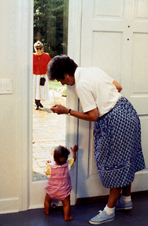 Woman and baby at a doorway